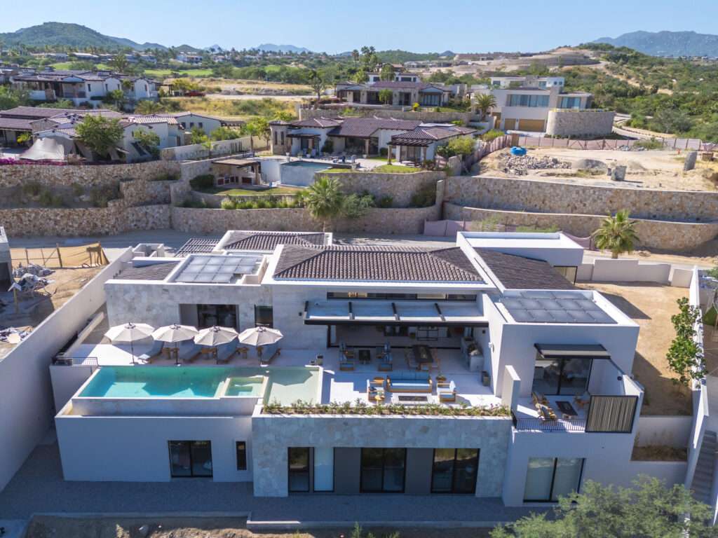 Querencia Section 18- Horizontes Welcome to Horizontes 3, an exquisite custom-made home located within San José del Cabo's most sought-after community, Querencia. Surrounded by Tom Fazio's signature golf course, recognized as one of the best in the country, this stunning residence is just a short golf cart ride from the prestigious 5-star Club House. This remarkable 6-bedroom, 6.5-bathroom home elevates luxury living with a fresh vision of architecture and design. The layout features a cozy family room, an expansive bunk bed bedroom on the lower level, and a spacious maid's quarters with an independent entrance, making it ideal for entertaining family and friends.The property boasts outdoor living spaces, including tranquil green areas, an outdoor kitchen, an infinity pool, a jacuzzi, and ocean and ravine – 3 Querencia, San Jose Corridor, BS