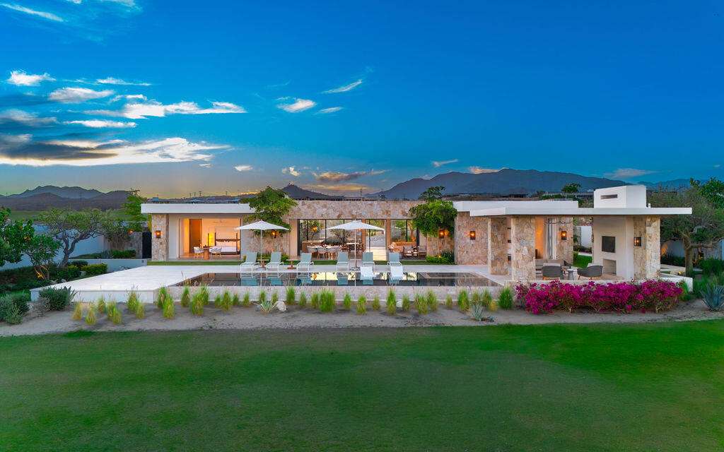 Querencia Section 18- Horizontes Welcome to Horizontes 3, an exquisite custom-made home located within San José del Cabo's most sought-after community, Querencia. Surrounded by Tom Fazio's signature golf course, recognized as one of the best in the country, this stunning residence is just a short golf cart ride from the prestigious 5-star Club House. This remarkable 6-bedroom, 6.5-bathroom home elevates luxury living with a fresh vision of architecture and design. The layout features a cozy family room, an expansive bunk bed bedroom on the lower level, and a spacious maid's quarters with an independent entrance, making it ideal for entertaining family and friends.The property boasts outdoor living spaces, including tranquil green areas, an outdoor kitchen, an infinity pool, a jacuzzi, and ocean and ravine – Querencia Golf and Ocean Club, San Jose Corridor, BS